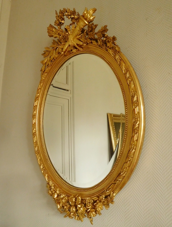 Grand miroir ovale de style Louis XVI en bois doré à la feuille d'or époque Napoleon III - 119cm x 79cm