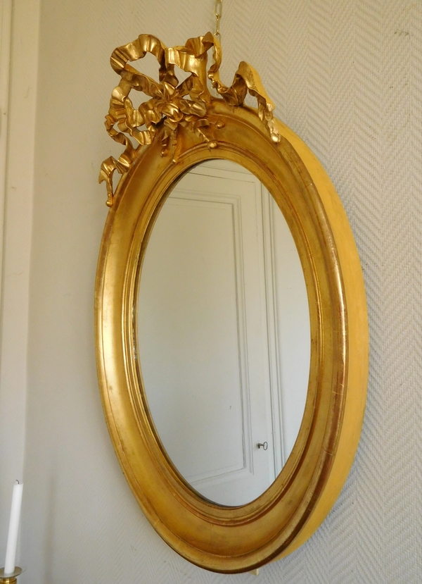 Louis XVI style gilt wood oval mirror, Napoleon III period - 71cm x 91cm