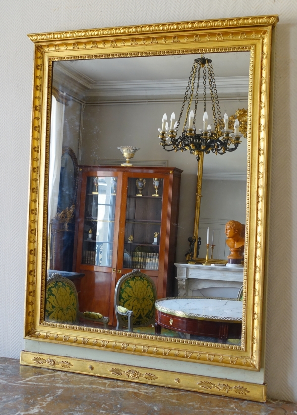 Trumeau, miroir de boiserie d'époque Empire en bois laqué et doré, glace au mercure