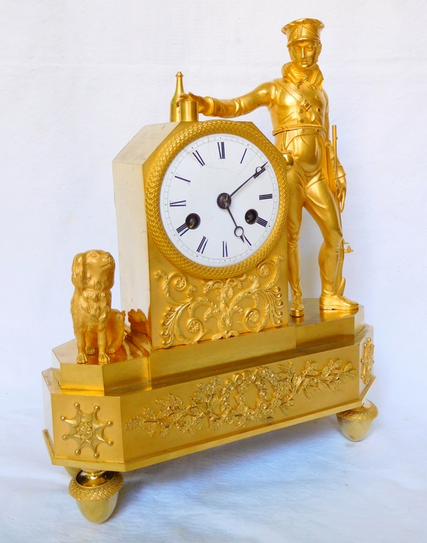 Empire ormolu clock picturing a hunter, early 19th century