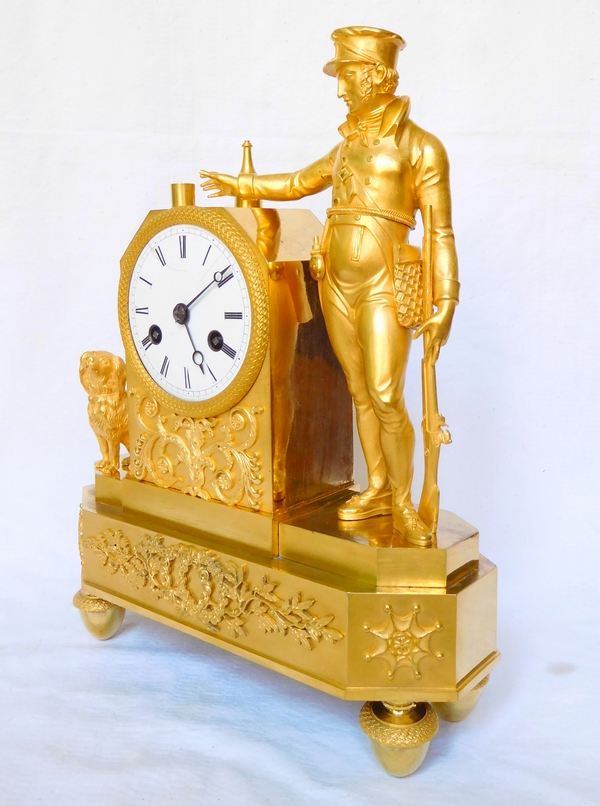 Empire ormolu clock picturing a hunter, early 19th century