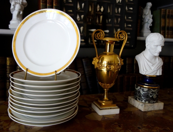 Set of 12 Paris porcelain dessert plates enhanced with fine gold, early 19th century