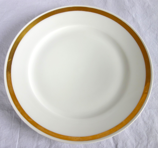 Set of 12 Paris porcelain dessert plates enhanced with fine gold, early 19th century