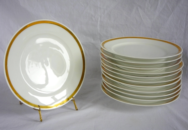 Set of 12 Paris porcelain dessert plates enhanced with fine gold, early 19th century