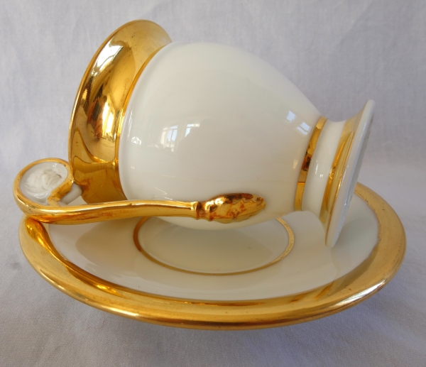 Pair of Empire Paris porcelain coffee cups enhanced with fine gold, early 19th century