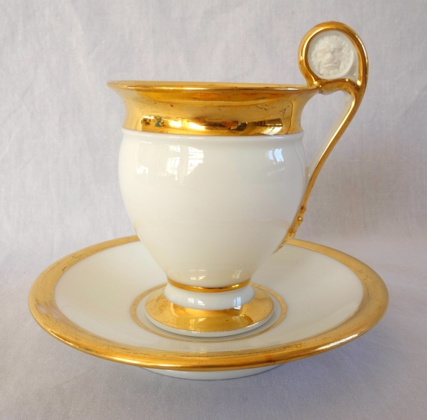 Pair of Empire Paris porcelain coffee cups enhanced with fine gold, early 19th century