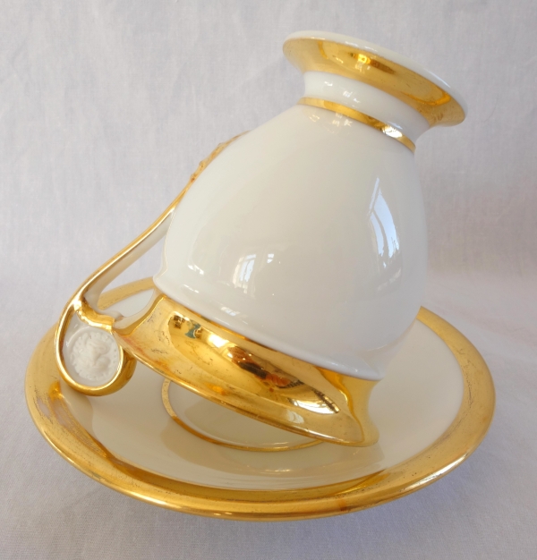 Pair of Empire Paris porcelain coffee cups enhanced with fine gold, early 19th century