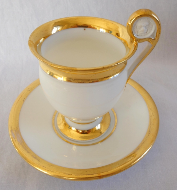 Pair of Empire Paris porcelain coffee cups enhanced with fine gold, early 19th century
