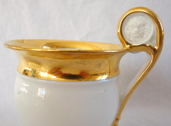 Pair of Empire Paris porcelain coffee cups enhanced with fine gold, early 19th century