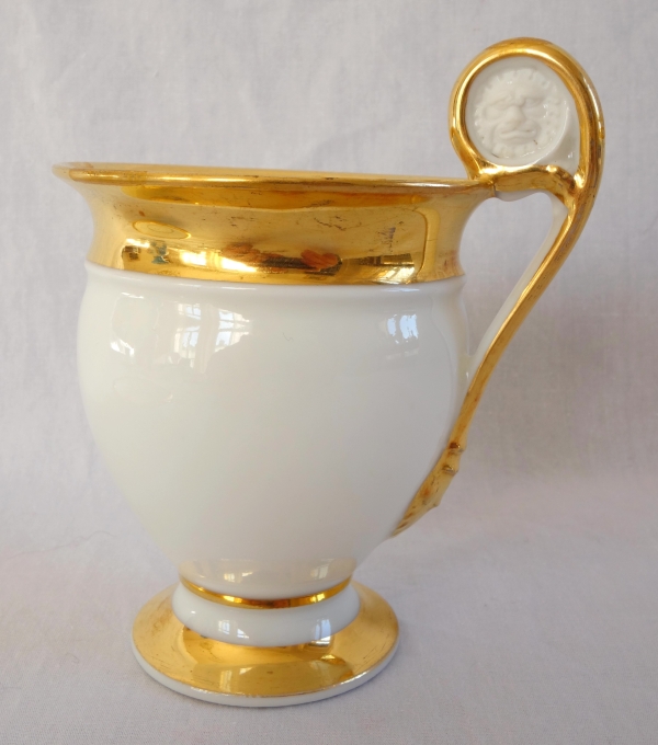 Pair of Empire Paris porcelain coffee cups enhanced with fine gold, early 19th century