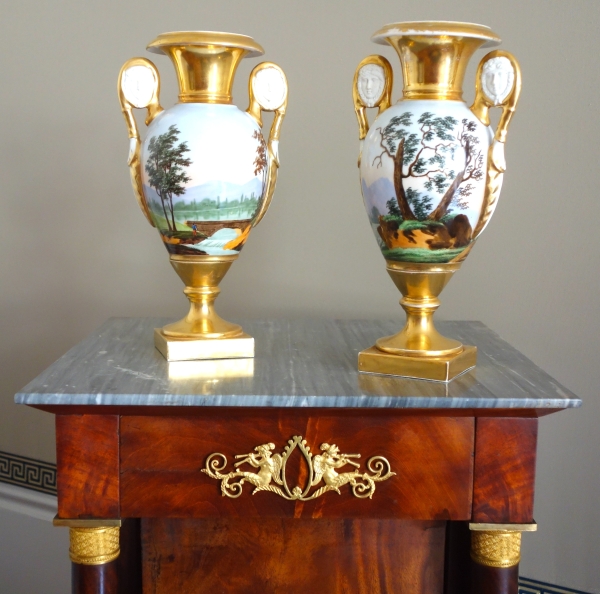 Pair of Empire Paris porcelain vases, biscuit handles, polychromatic landscapes