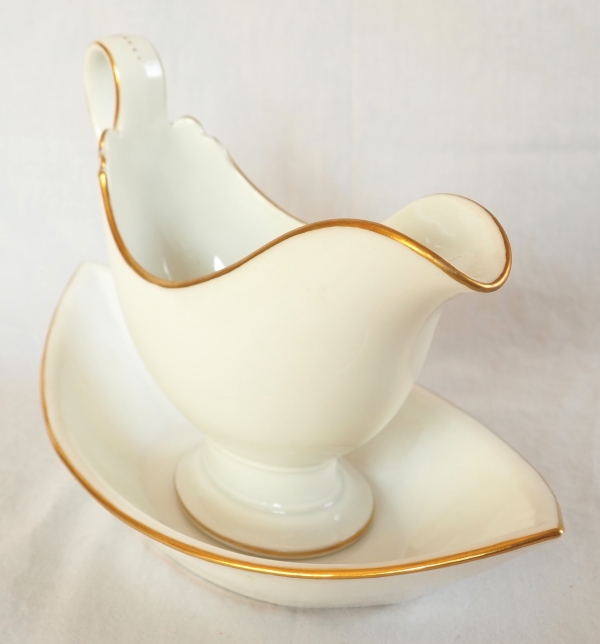 Nast : saucière d’époque Empire en porcelaine de Paris blanche et or