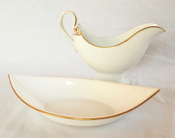 Nast : saucière d’époque Empire en porcelaine de Paris blanche et or