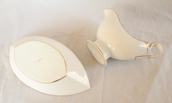 Nast : saucière d’époque Empire en porcelaine de Paris blanche et or