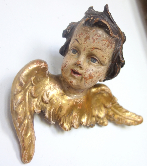 Pair of baroque winged angels busts, polychromatic and gilt wood, early 18th century