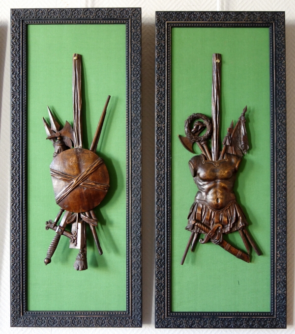 Suite de 4 trophées en bois finement sculptés, trophées d'armes militaires, époque Louis XVI
