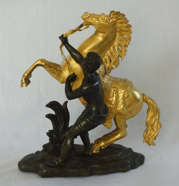An ormolu and patinated bronze Marly Horse after Coustou - early 19th century