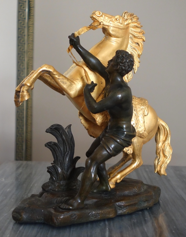 An ormolu and patinated bronze Marly Horse after Coustou - early 19th century