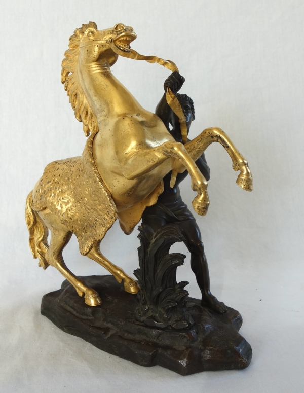 An ormolu and patinated bronze Marly Horse after Coustou - early 19th century