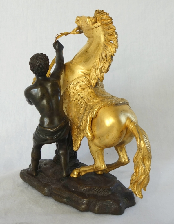 An ormolu and patinated bronze Marly Horse after Coustou - early 19th century