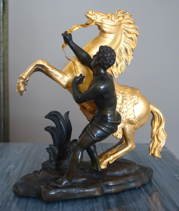An ormolu and patinated bronze Marly Horse after Coustou - early 19th century