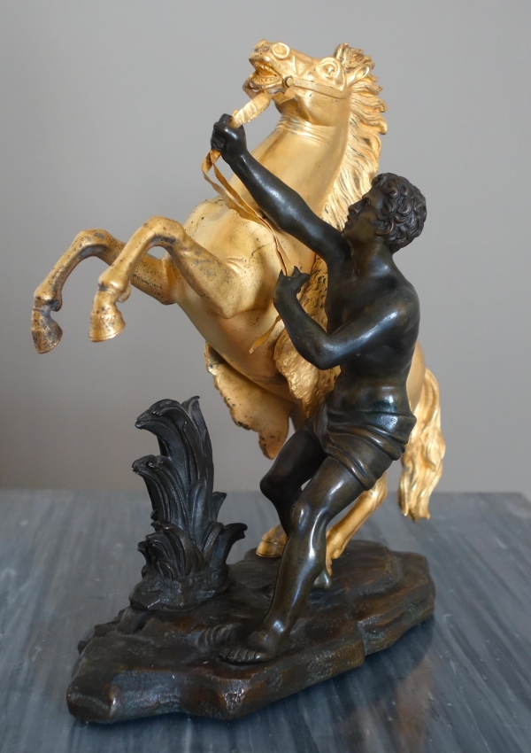 An ormolu and patinated bronze Marly Horse after Coustou - early 19th century