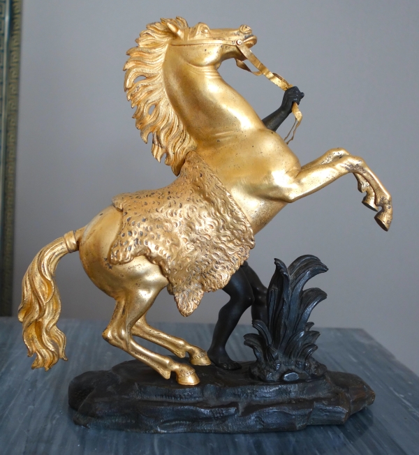 An ormolu and patinated bronze Marly Horse after Coustou - early 19th century