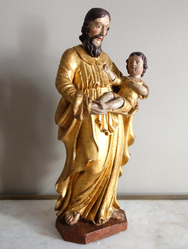 Saint Joseph et l'enfant Jésus : statue en bois doré - Alsace, XVIIe siècle - 72cm