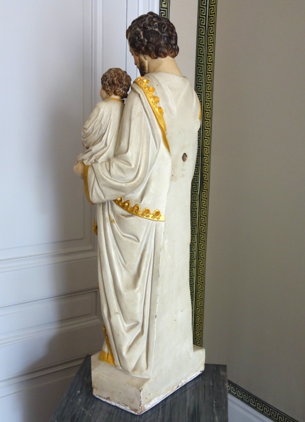 Tall polychromatic and gilt plaster statue of St Joseph holding Jesus Child - 19th century