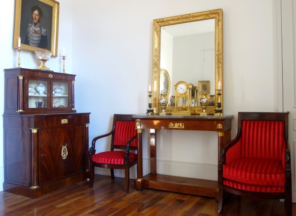 Empire mahogany bergere, dolphin-shaped armrests, early 19th century