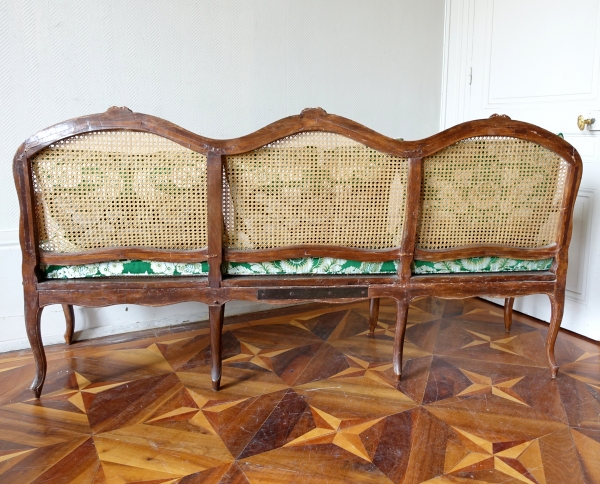 Louis XV walnut canned sofa, 18th century