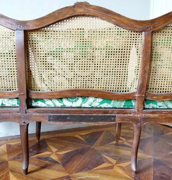 Louis XV walnut canned sofa, 18th century