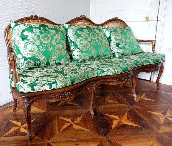 Louis XV walnut canned sofa, 18th century