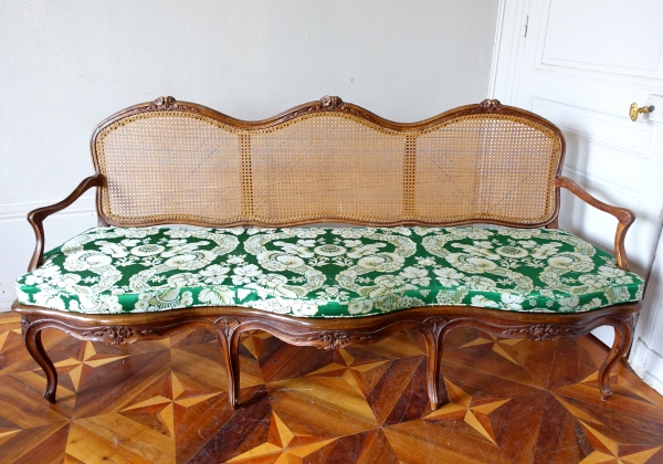 Louis XV walnut canned sofa, 18th century