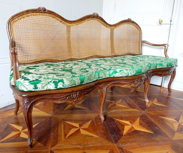 Louis XV walnut canned sofa, 18th century