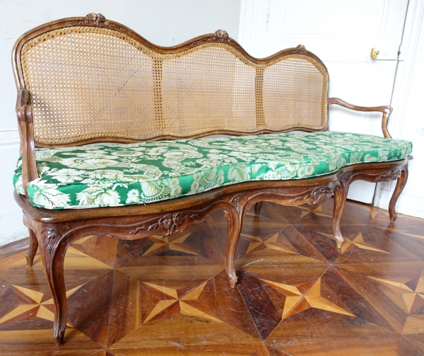 Louis XV walnut canned sofa, 18th century