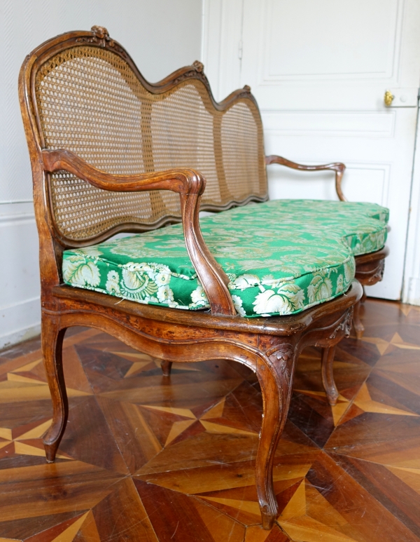 Louis XV walnut canned sofa, 18th century