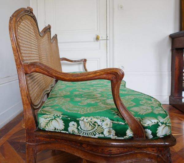 Louis XV walnut canned sofa, 18th century