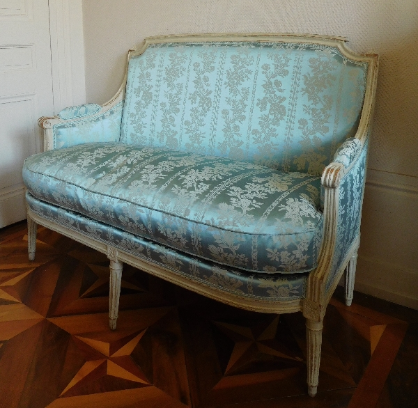 Louis XVI sofa for 2 persons, lacquered wood and blue silk, 18th century
