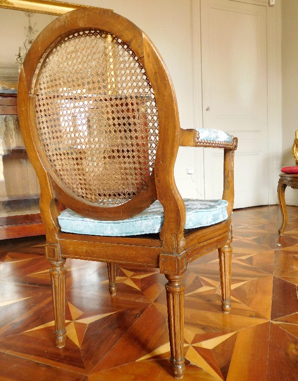 Louis XVI caned walnut desk armchair - France circa 1780
