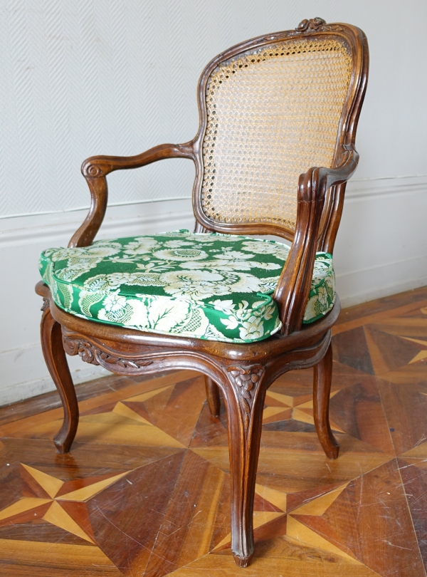 Louis XV walnut canned cabriolet armchair, 18th century