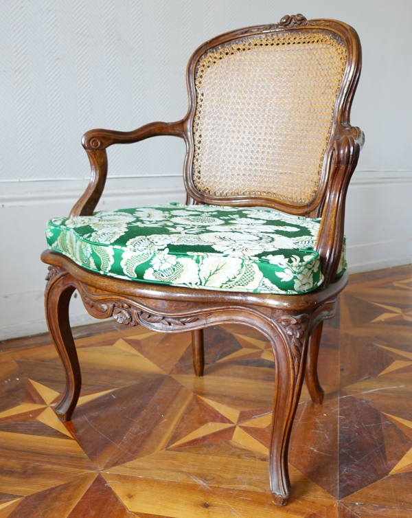 Louis XV walnut canned cabriolet armchair, 18th century